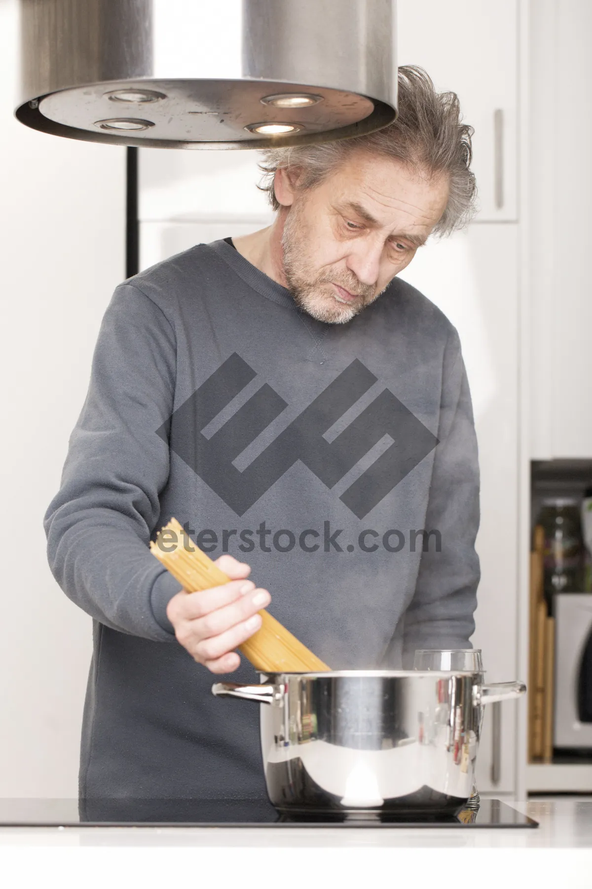 Picture of Happy man playing steel drum at home.