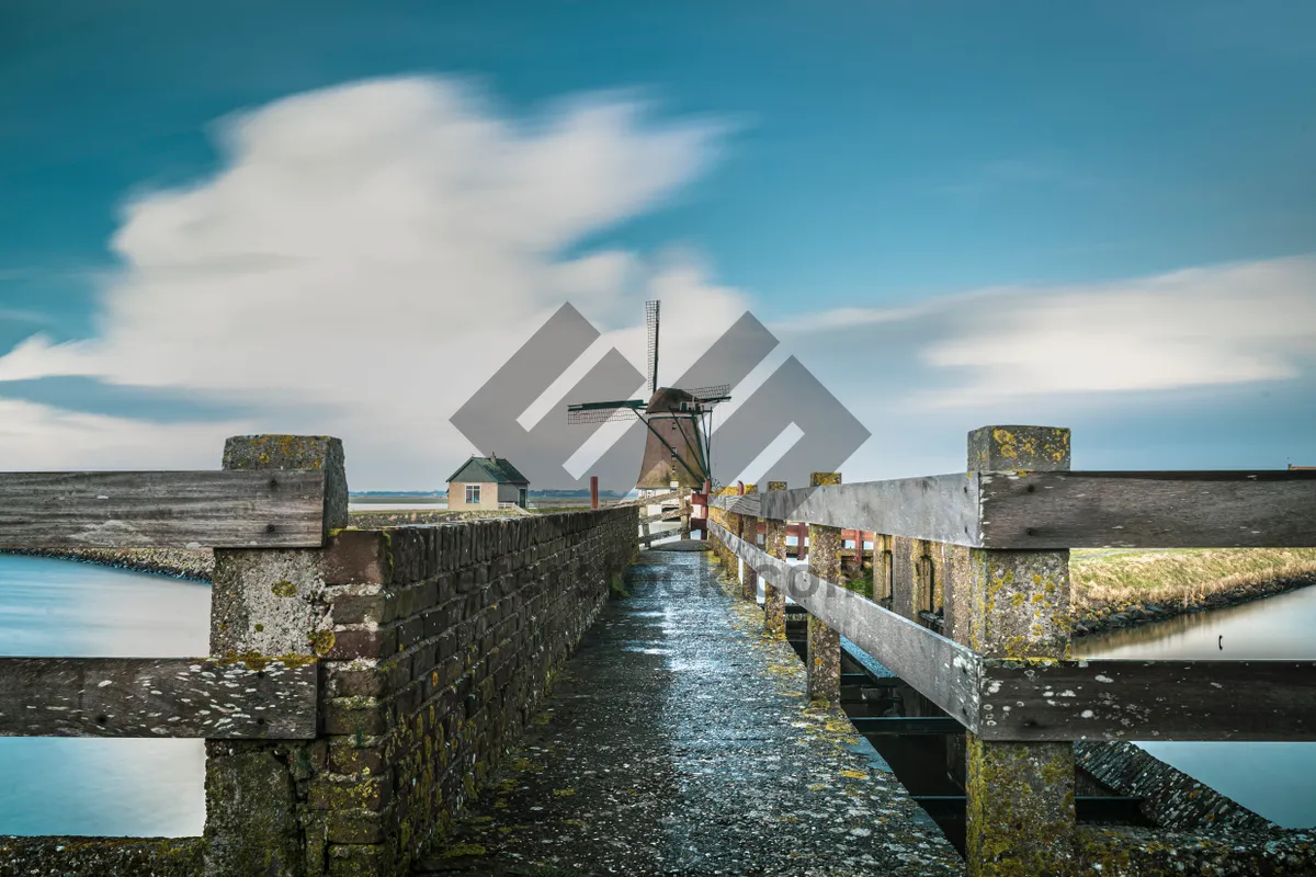 Picture of Historic Bridge Over River in City Landscape Skyline