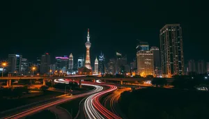 Modern office tower in city skyline at night