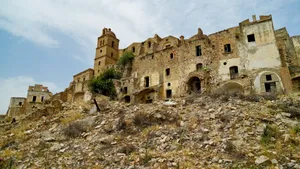 Medieval fortress in historic city skyline.