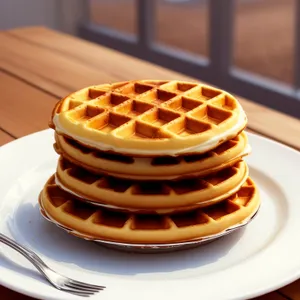 Delicious chocolate waffle with syrup and coffee.