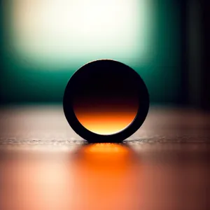 Shining Sun Circle Icon with Bright Orange Reflection"
or
"Vibrant Web Design Lamp with Glass Button and Starry Spotlight