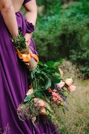 Beautiful woman in summer dress with flower bouquet