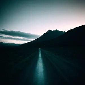 Serene Sunset Journey through Mountainous Landscape