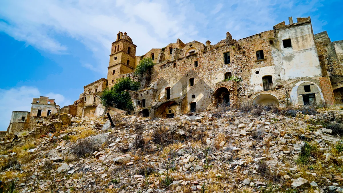 Picture of Medieval fortress against blue sky in ancient city.