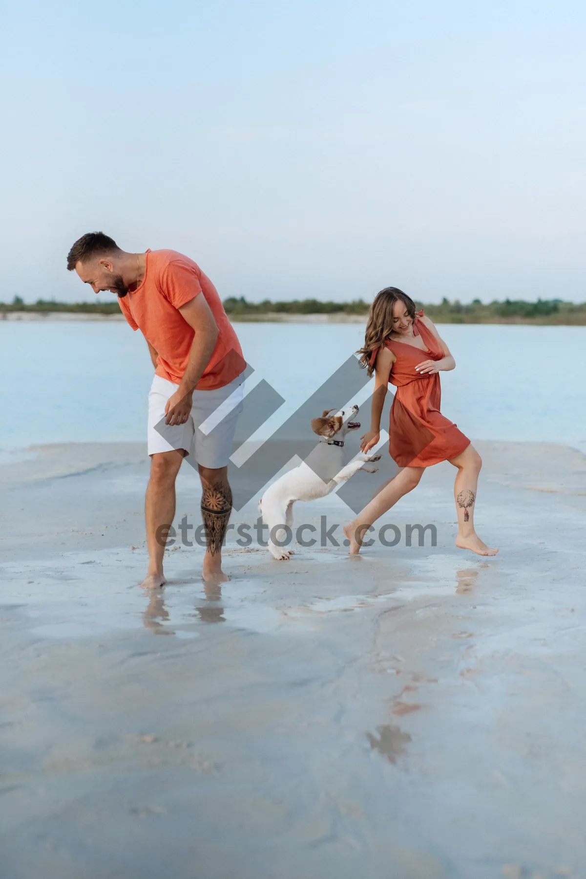 Picture of Happy family walking on the beach under the summer sky