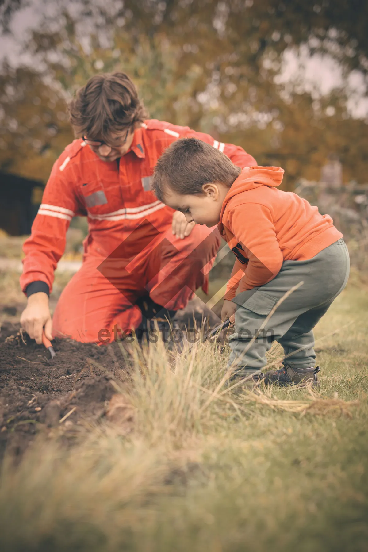 Picture of Happy father and son smiling in the park