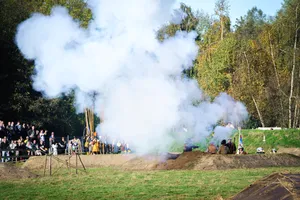 Volcanic landscape with steam and smoke