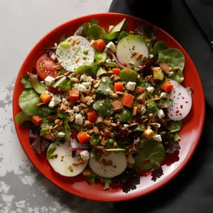 Fresh salad with vegetables and healthy sauce dressing.