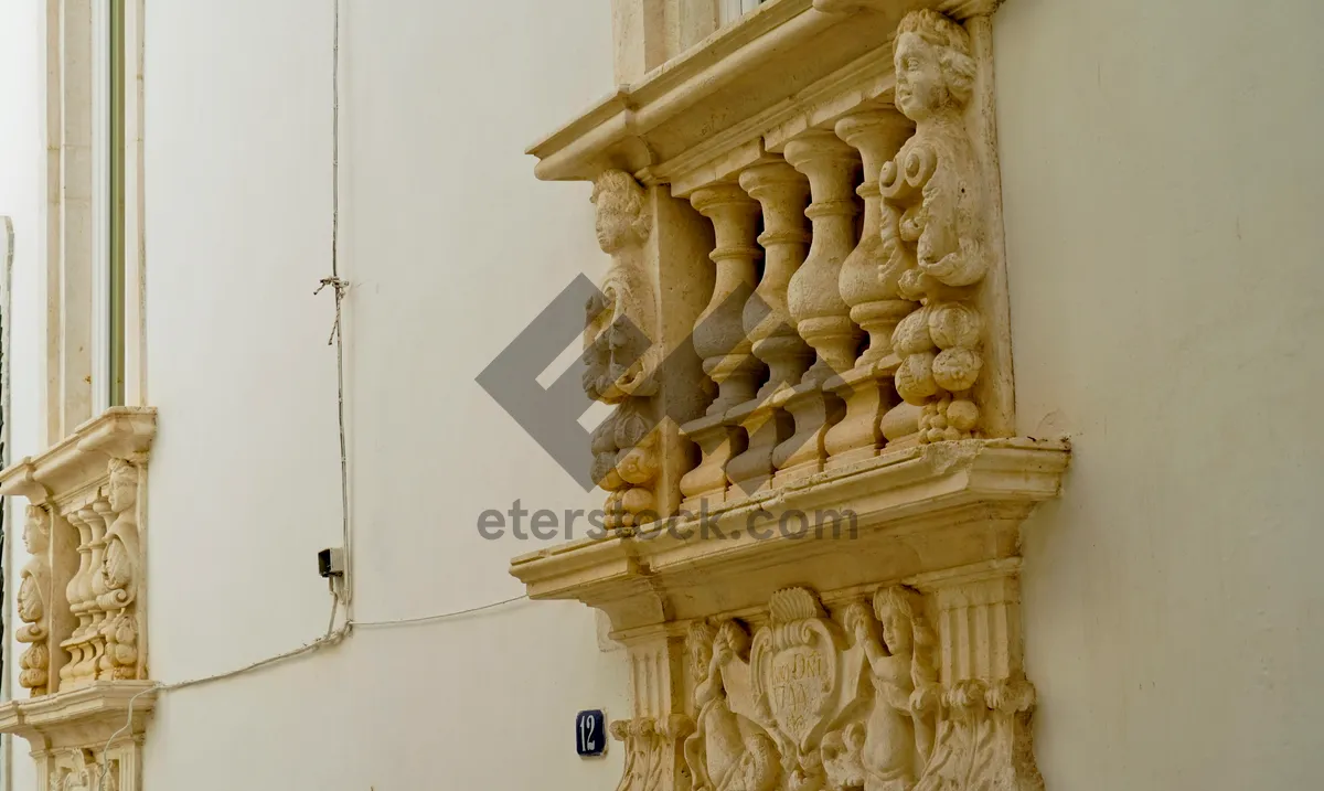 Picture of Ancient temple column sculpture in historic city.