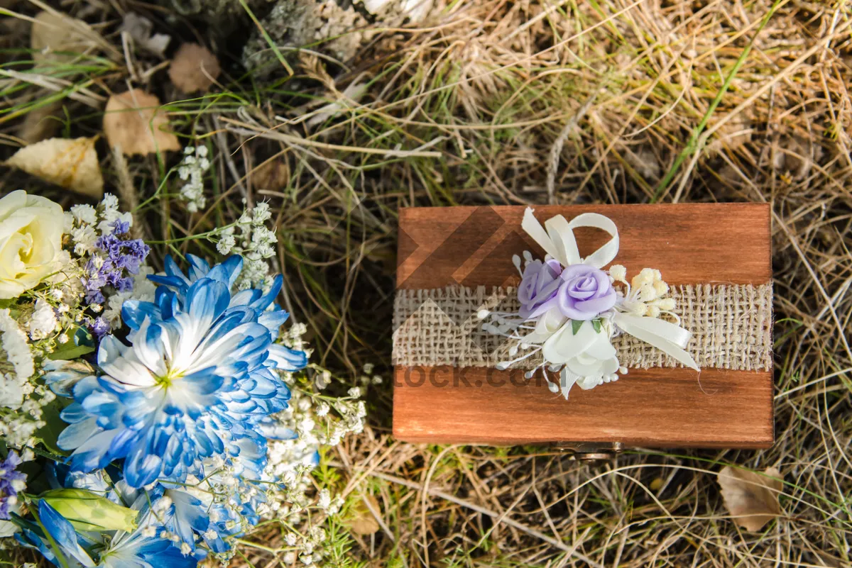 Picture of Container tray with cup, flower and rubbish.