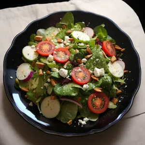 Grilled chicken salad with fresh vegetables and olives.