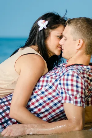 Attractive couple enjoying summer beach vacation together.