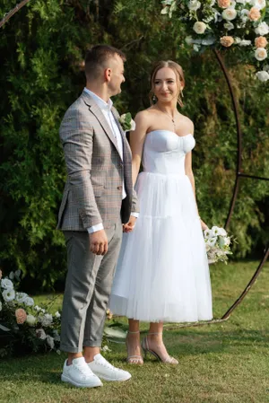 Happy wedding couple in the park celebrating love.