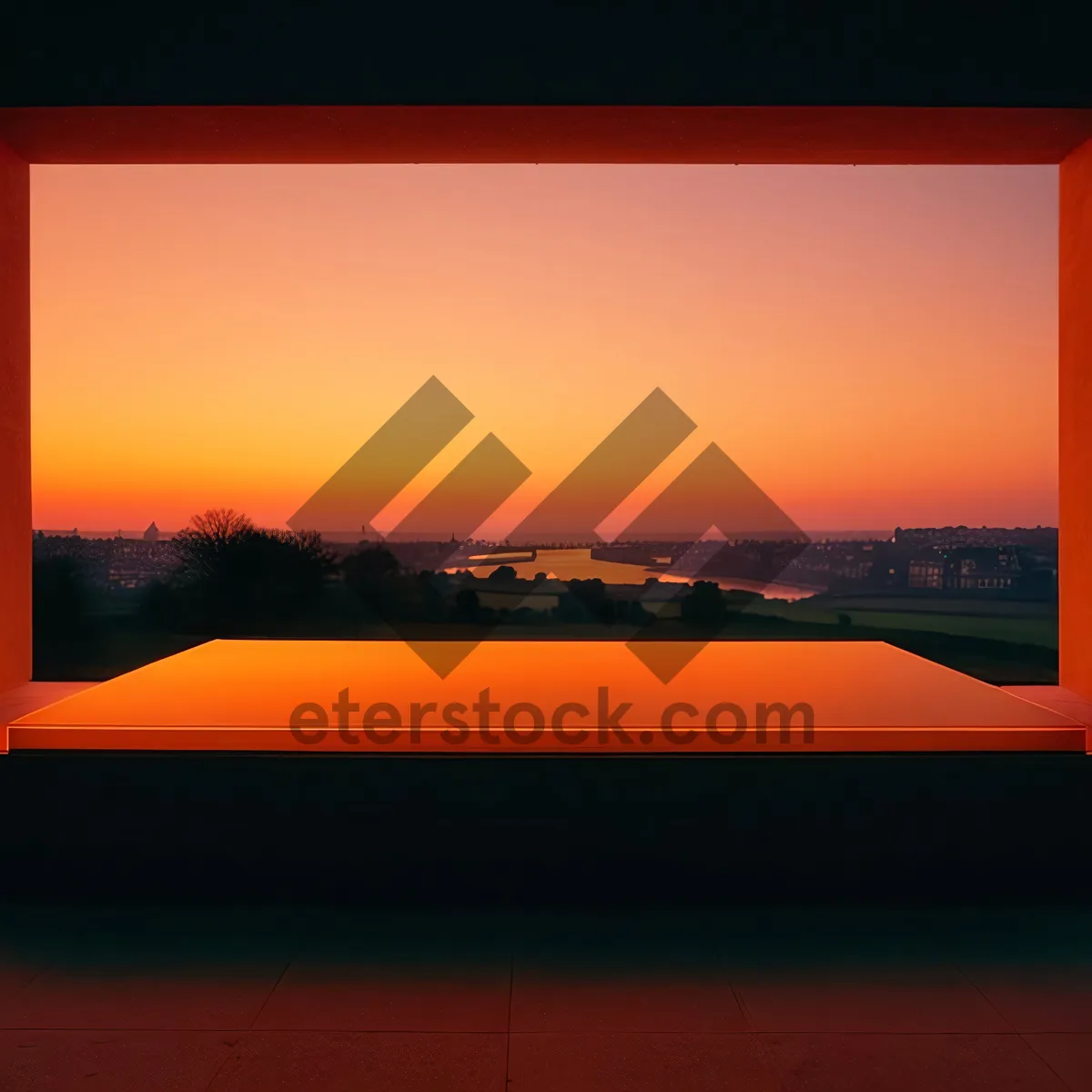 Picture of Tropical sunset silhouette over ocean with orange sky.