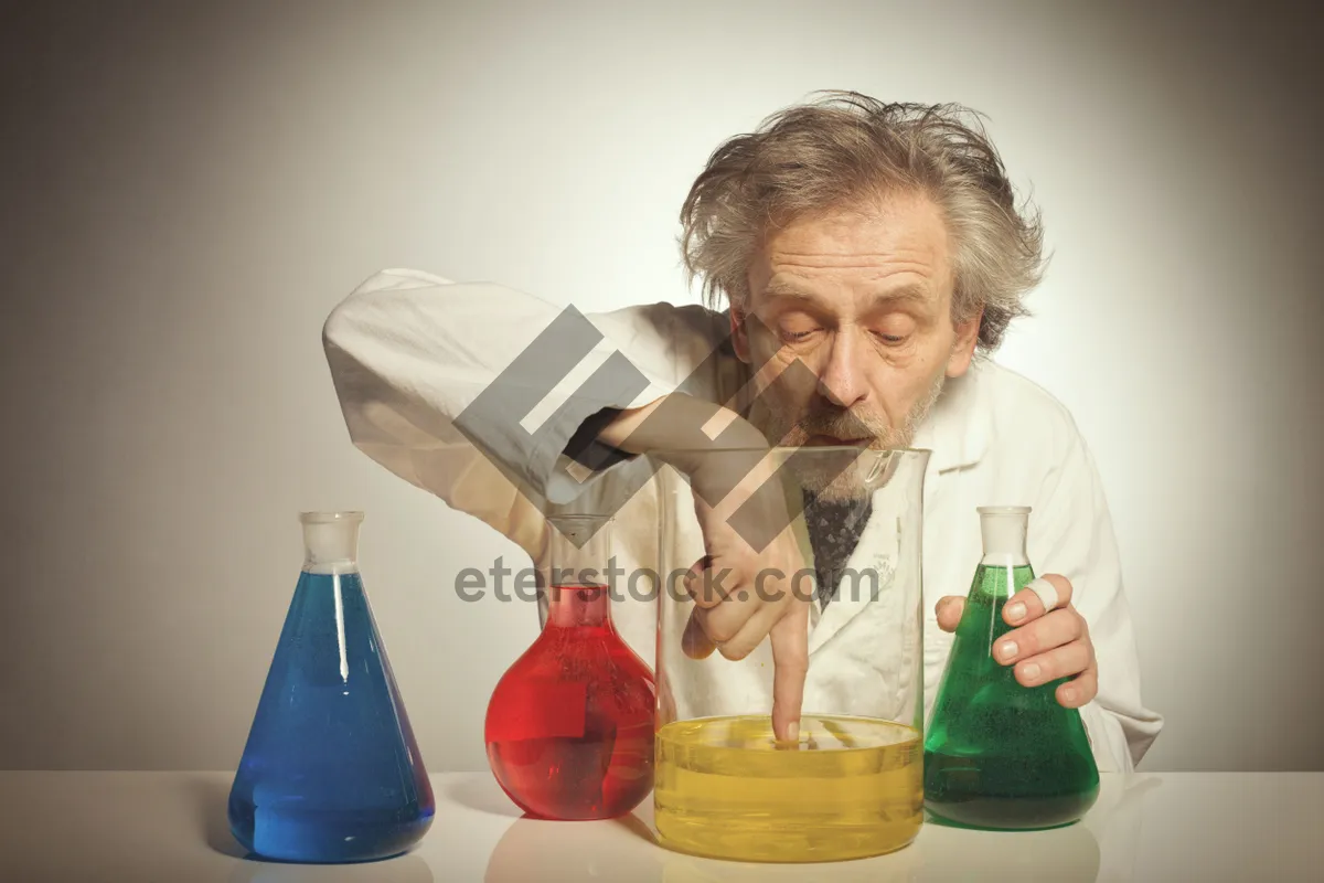 Picture of Happy elderly couple smiling with water jug at home