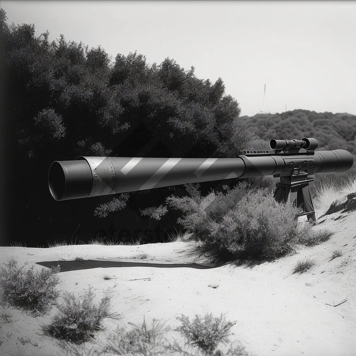 Picture of High-Angle Artillery Cannon in Majestic Cloudy Landscape