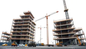 Industrial Crane Equipment at Urban Construction Site.