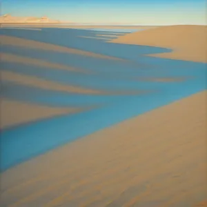 Vivid Desert Dunes Amidst Sunlit Horizon
