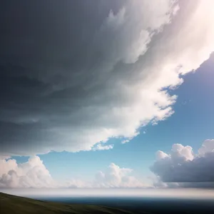 Golden Horizon: Majestic Mountains and Dramatic Clouds