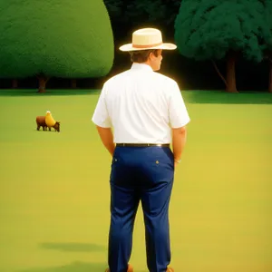 Golfer in Cowboy Hat Swinging at Tee