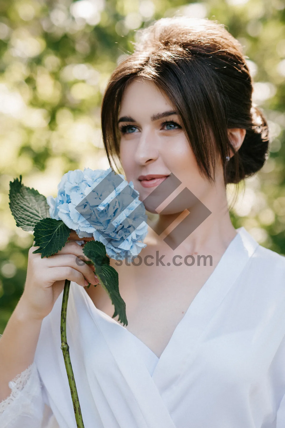 Picture of Happy bride with bouquet on wedding day