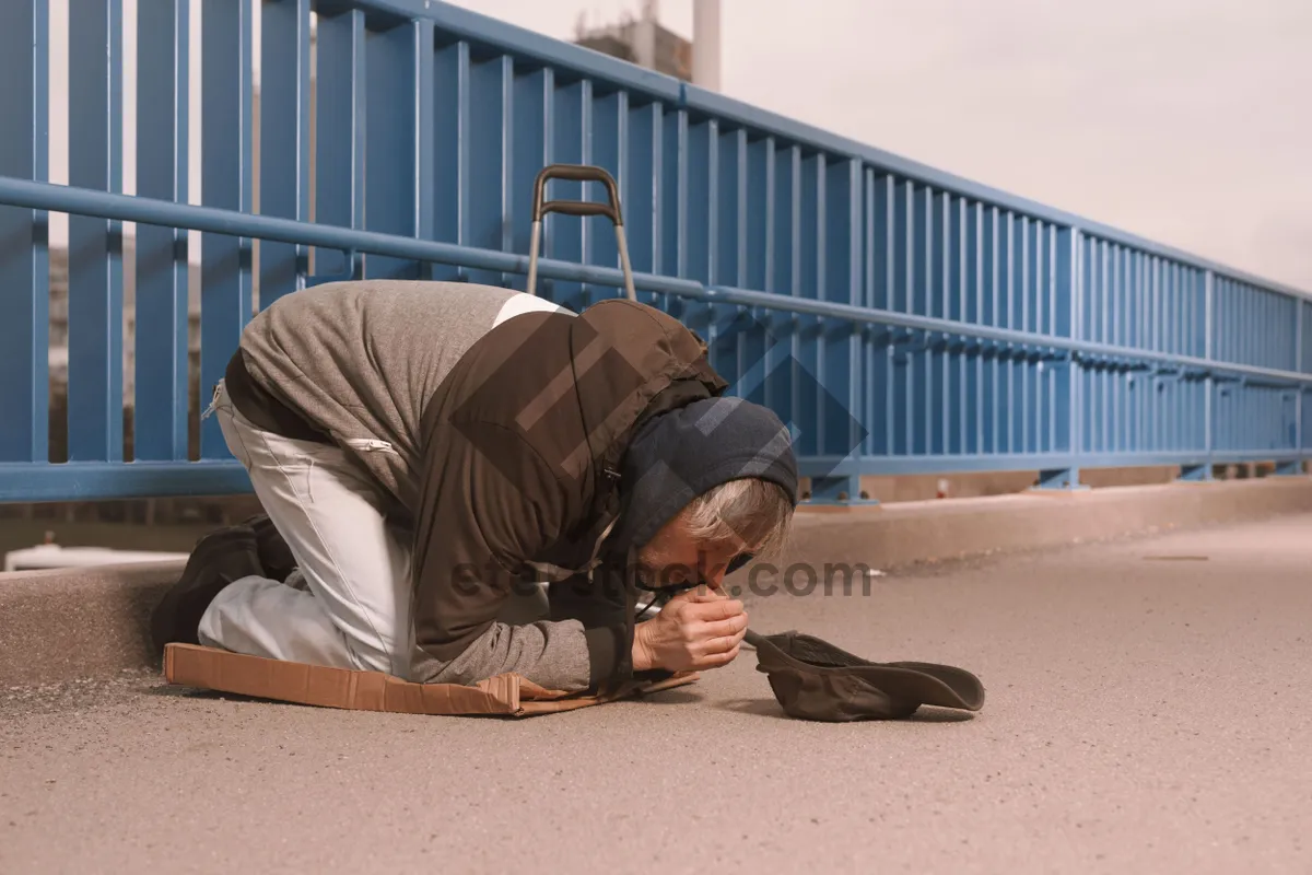 Picture of Adult man with sleeping bag outdoors