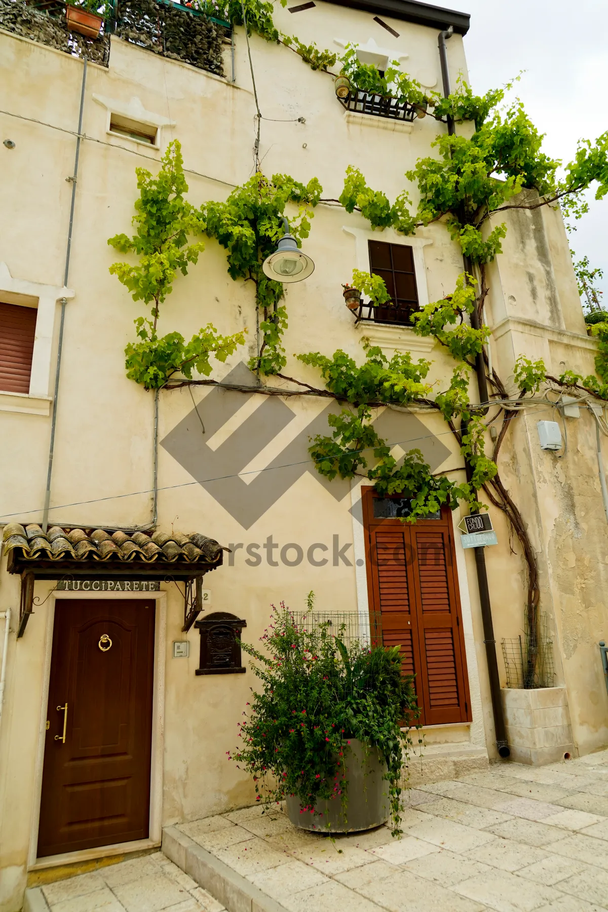 Picture of Old town house with balcony, stone facade.