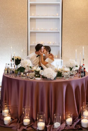 Happy couple celebrating wedding at fancy restaurant interior.