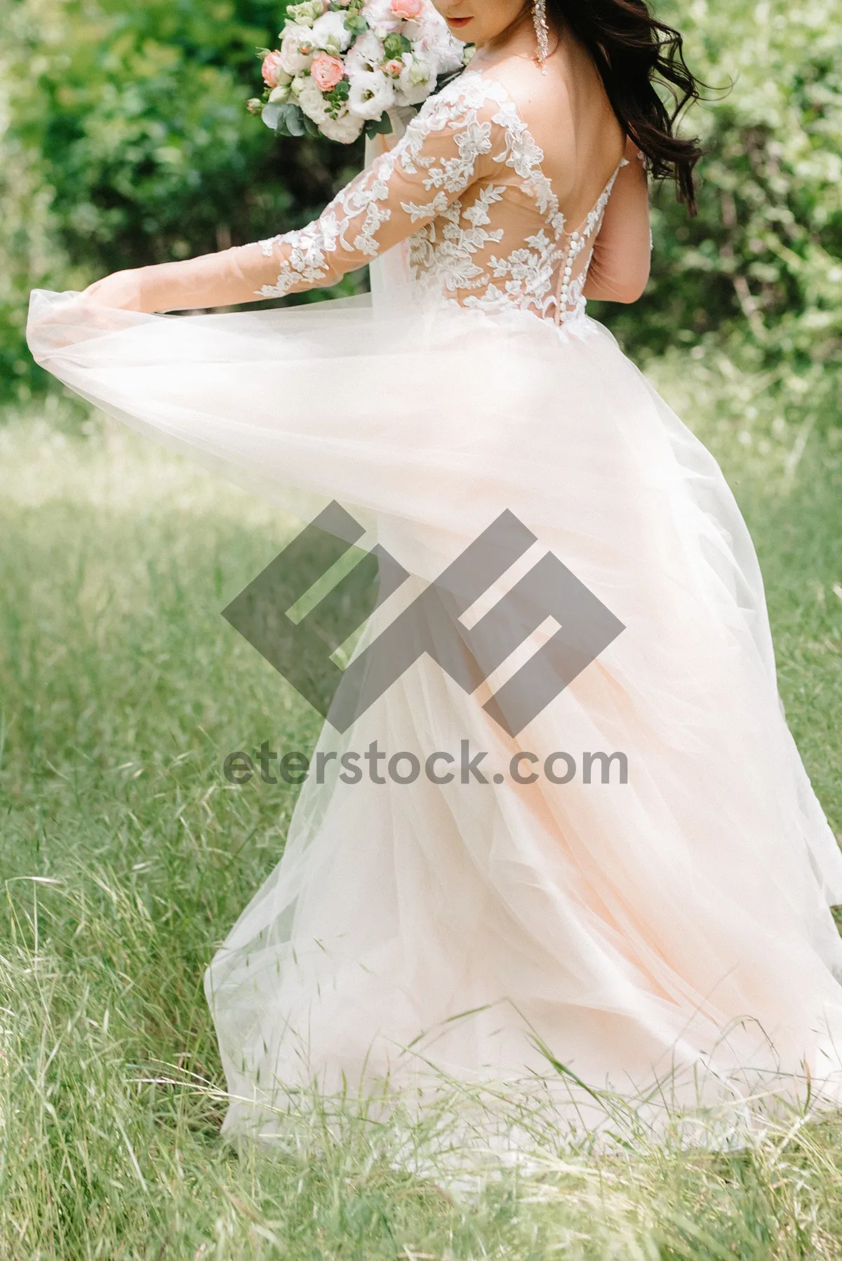 Picture of Outdoor wedding photo of smiling blonde bride and groom.