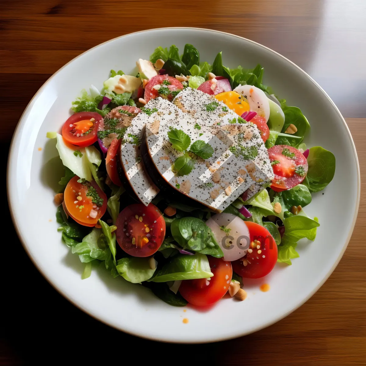 Picture of Fresh vegetable salad with tomatoes, cheese, and vinaigrette dressing