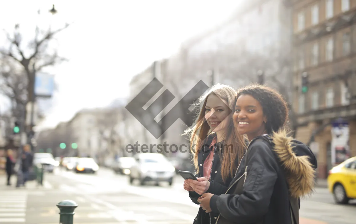 Picture of Smiling Businesswoman Outdoors with Phone