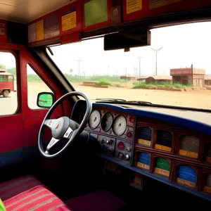 Fast-moving car on busy highway with control panel.