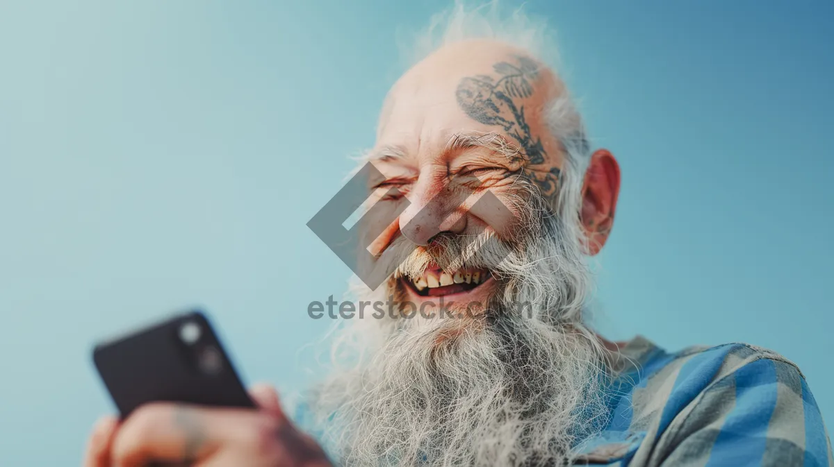 Picture of Elderly man with gray beard and mustache smiling