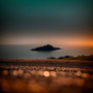 Golden Horizon: Sun reflecting on serene ocean waves.
