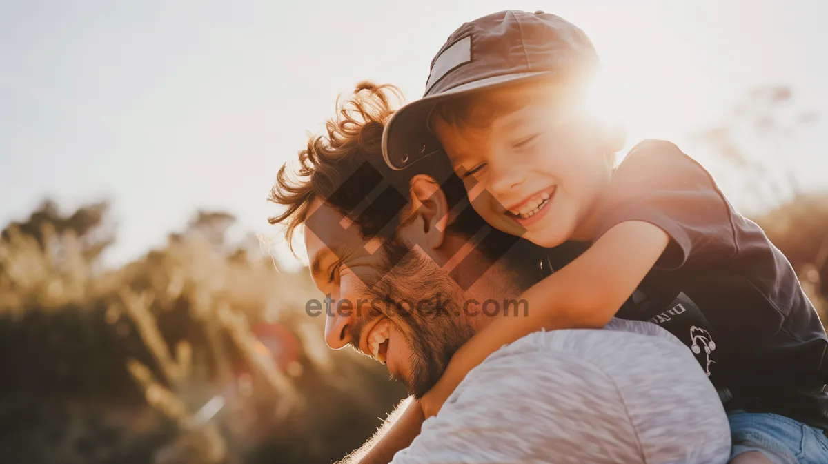 Picture of Happy couple in bed smiling together, brunette man.