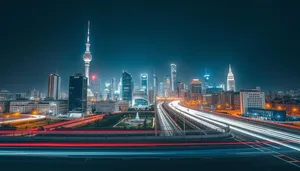 Modern city skyline at night with river reflection