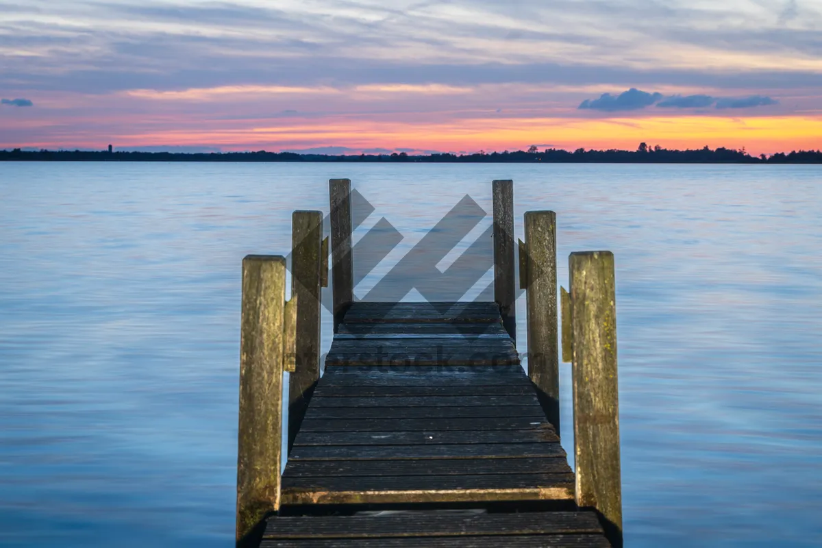 Picture of Vacation getaway on wooden pier overlooking tranquil ocean landscape