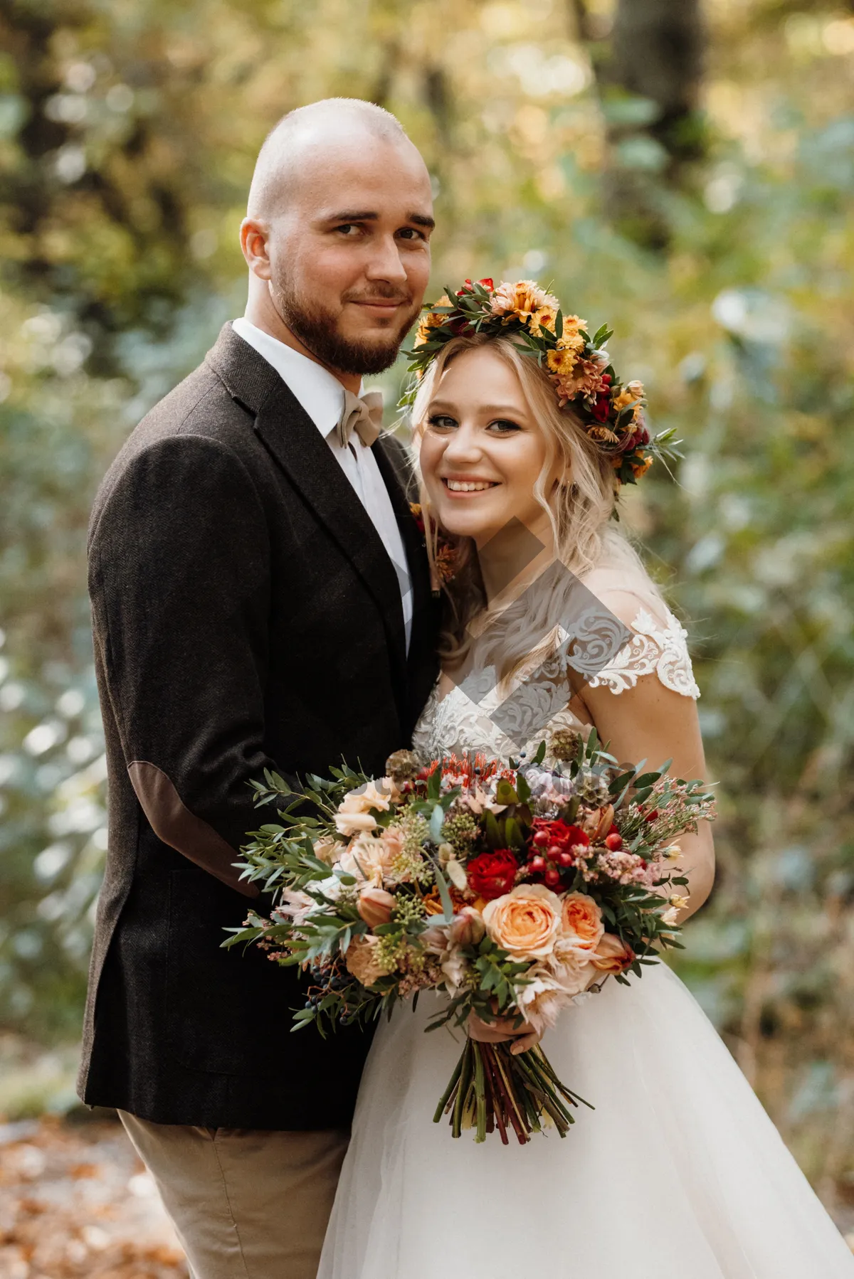 Picture of Happy couple celebrating their wedding day outdoors with flowers