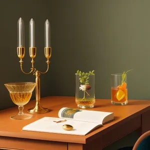 Luxurious dining table setting with candles and wine.