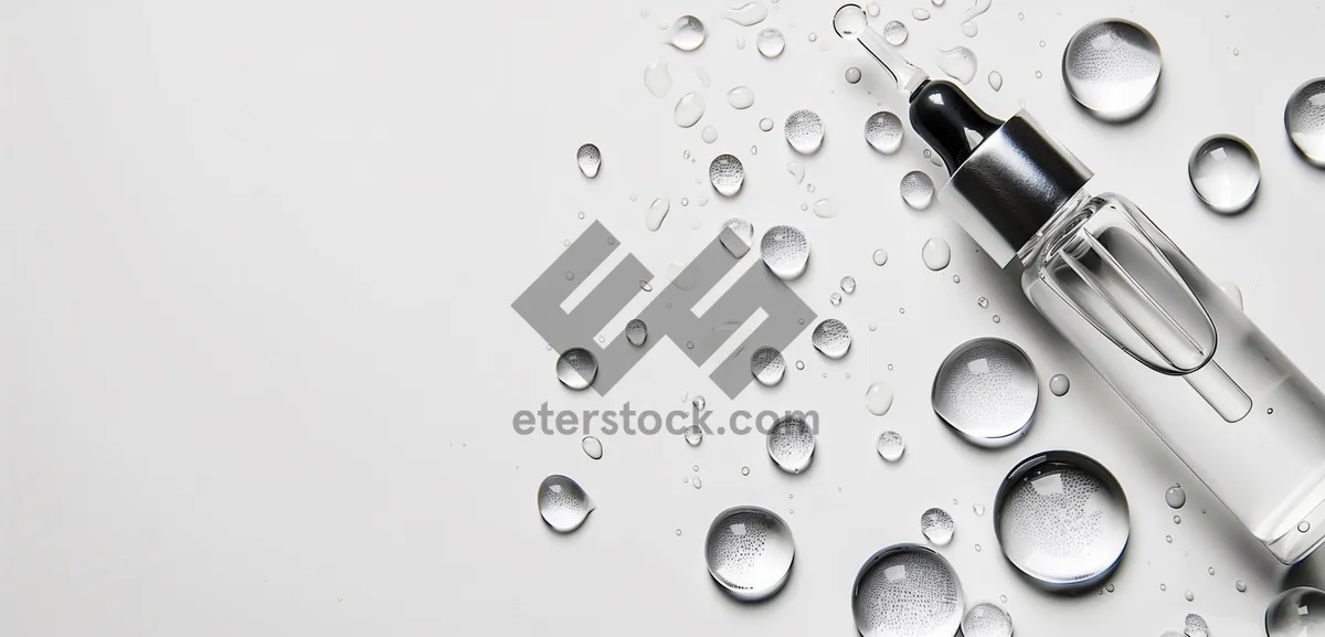 Picture of Clear Water Droplet on Glass Surface