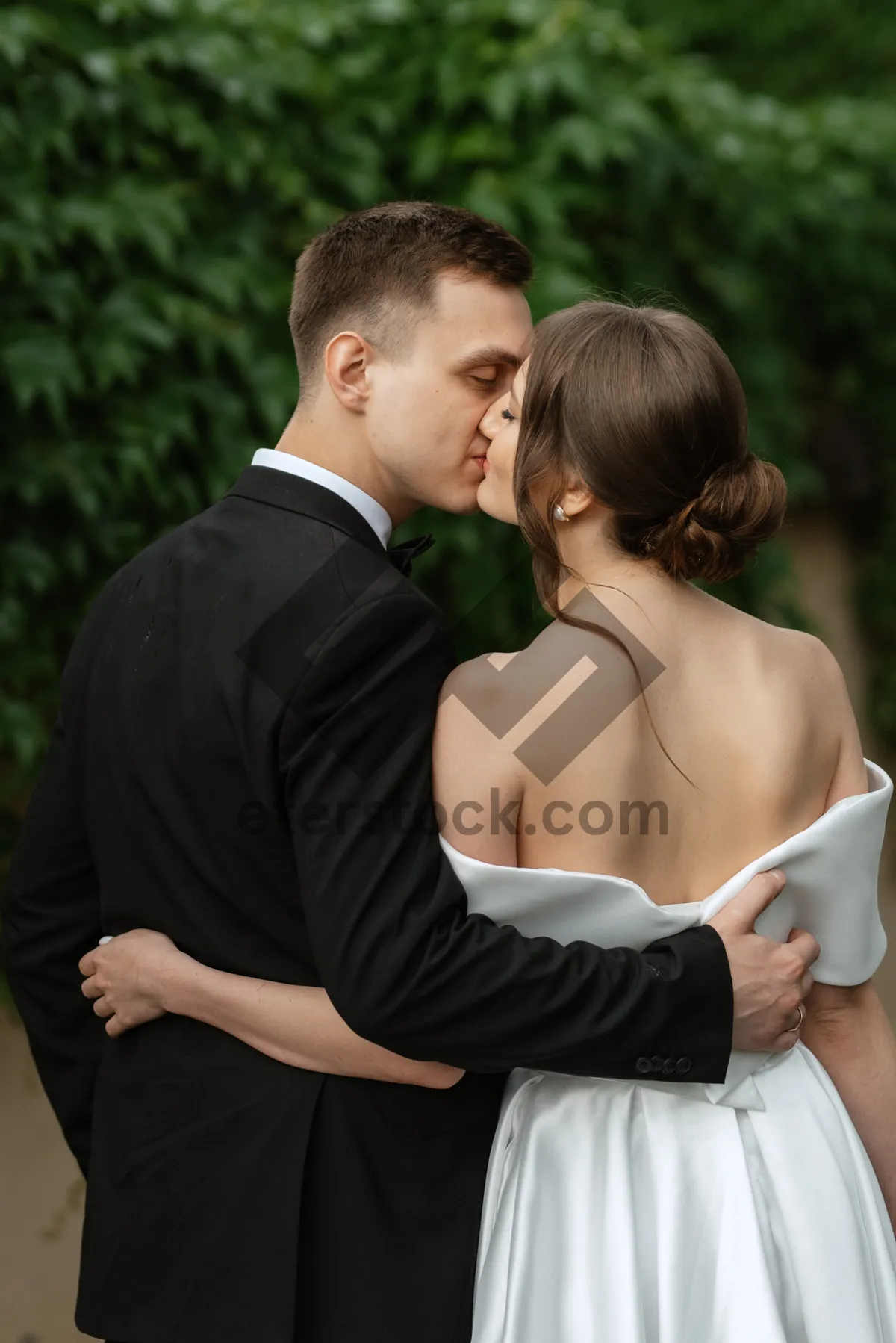 Picture of Loving Couple in Wedding Attire Smiling Outdoors