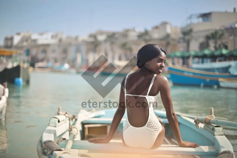 Picture of Attractive Model Relaxing on Tropical Beach in Swimsuit