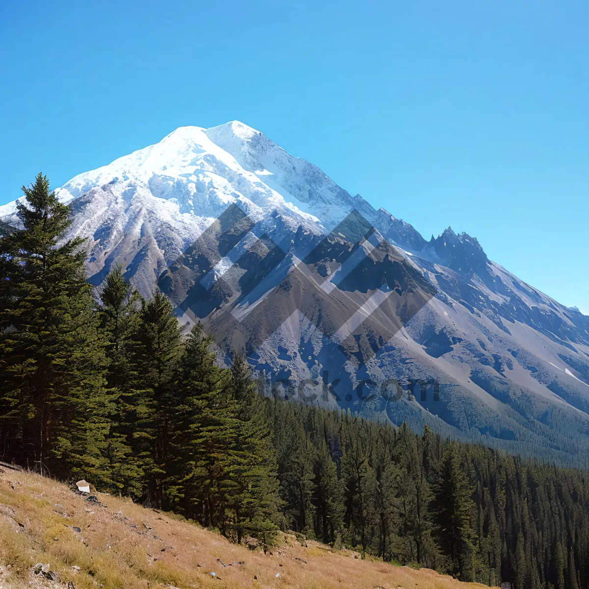 Picture of Snow-capped peak amidst stunning mountain range.