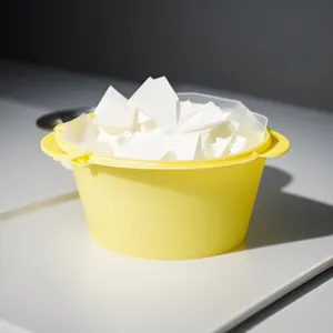 Fresh sweet yellow butter in glass bowl dessert.