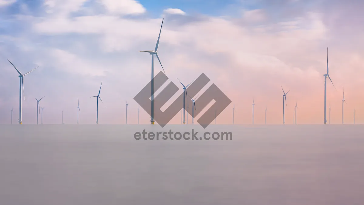 Picture of Renewable energy wind turbines in the sky landscape.