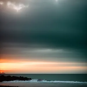 Vibrant Sunset Over Ocean Shoreline