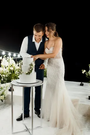 Happy couple celebrating their wedding day outdoors.