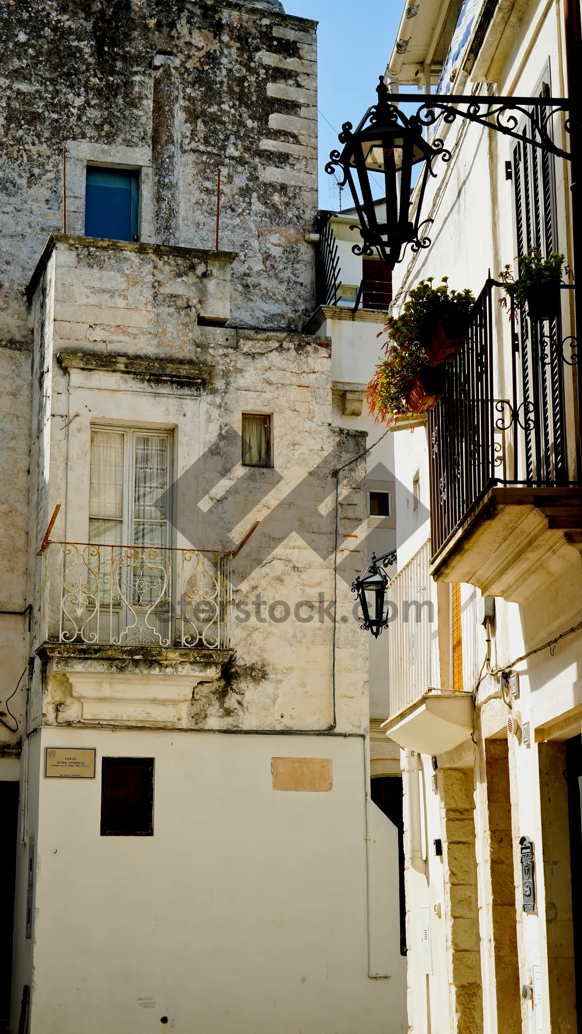 Picture of Old city stone building with windows and balcony