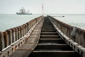 Wooden pier overlooking serene ocean waters